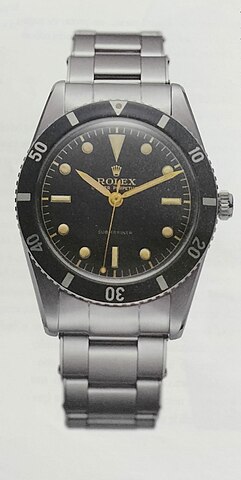 1953 Rolex Submariner ref. 6204 with a stainless steel bracelet and black dial.